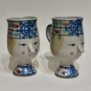 Set of 2 Hand Painted Fitz & Floyd Folk Figural Face Stoneware Pedestal Mugs